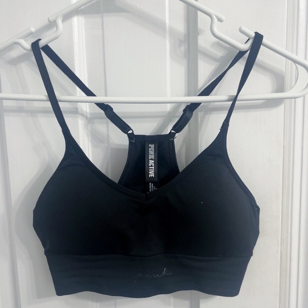 pink sports bra never worn black